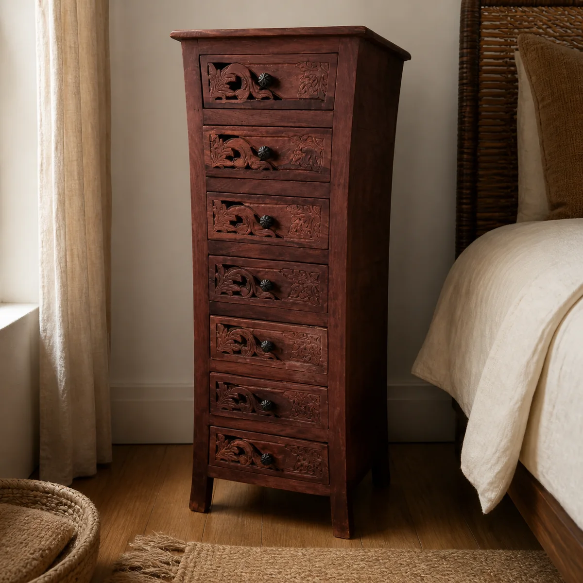 Himba Carved Drawer Tower staged in a compact bedroom.