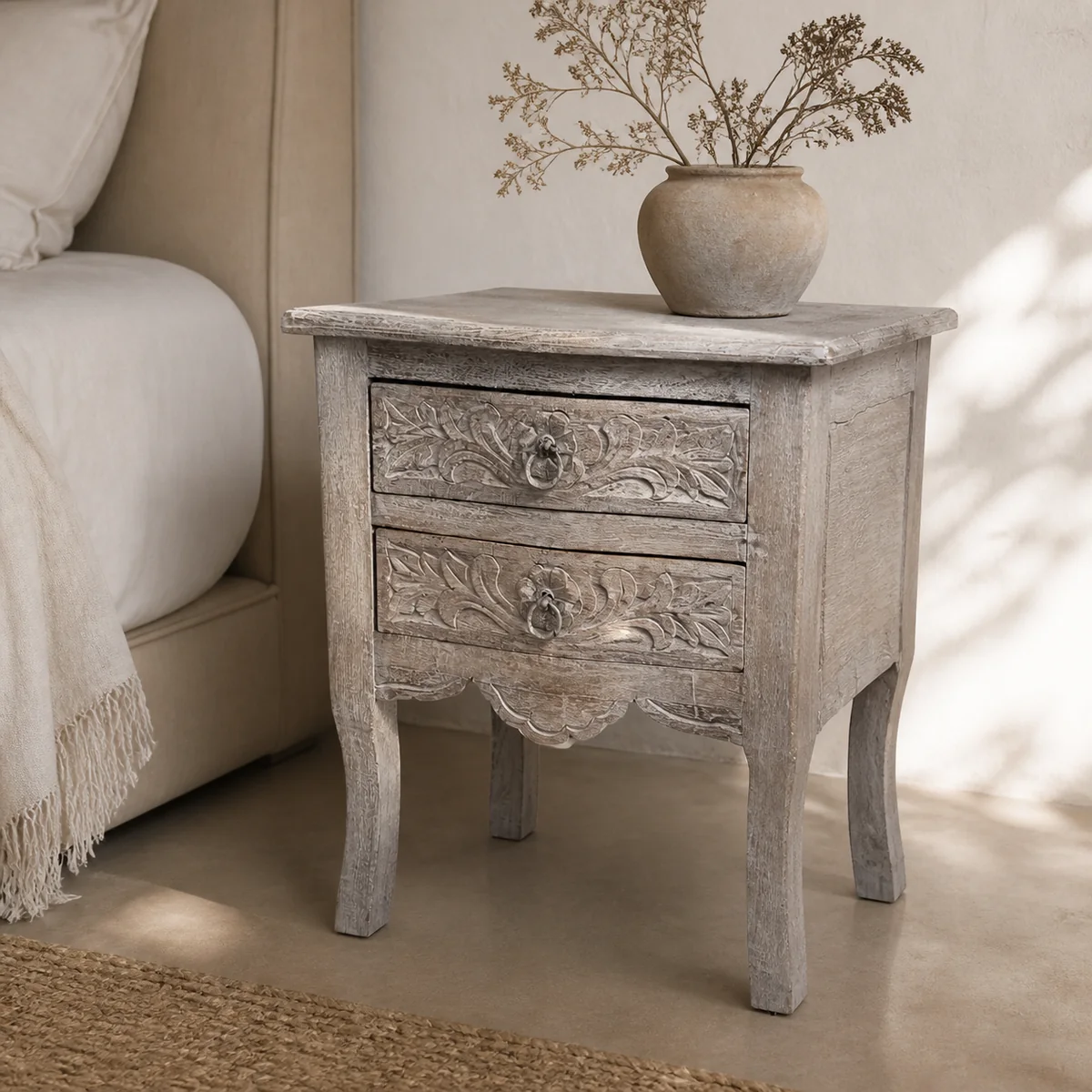 Mopane Curve Bedside Chest staged in a warm-plaster bedroom.